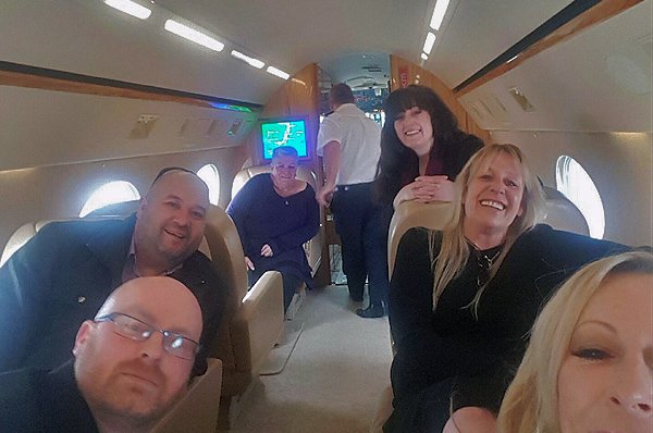 Management Team enjoys a charity private jet flight